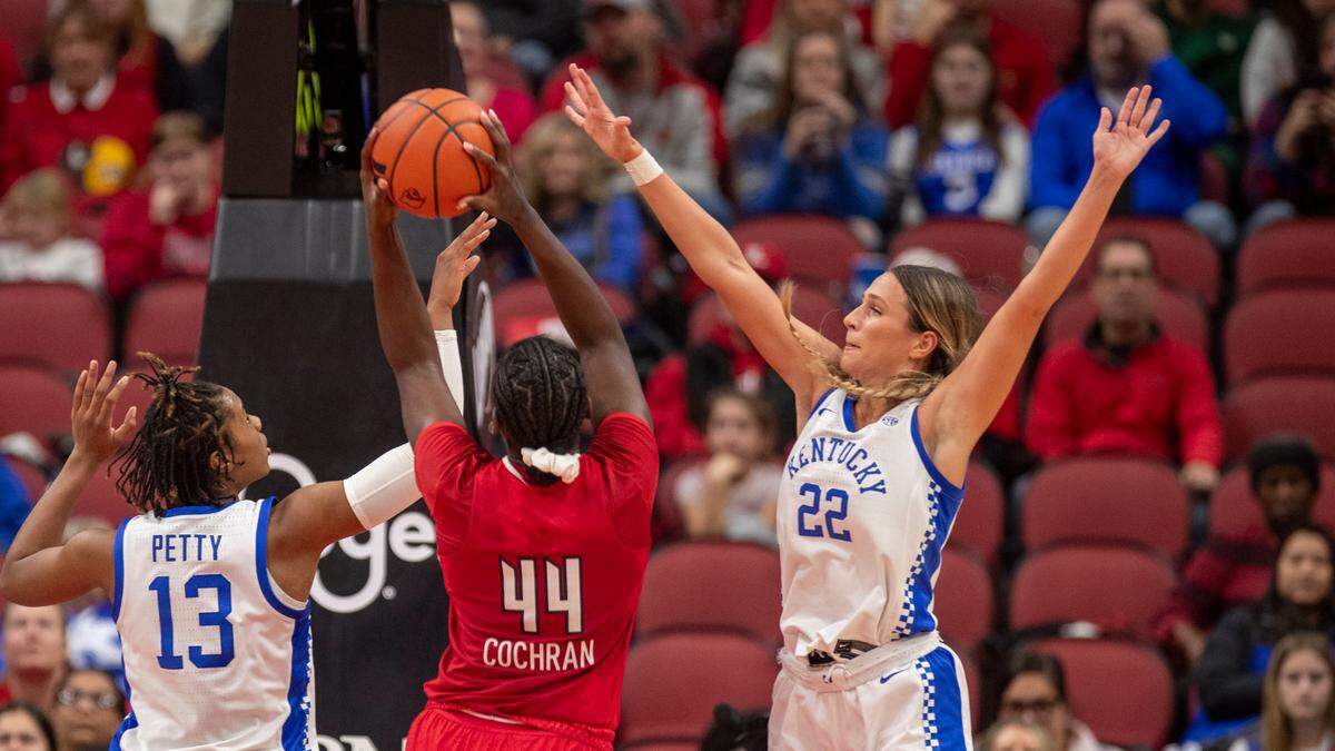 Maddie Scherr, right, led the Wildcats in scoring with 22 points against No. 18 Louisville in her return from concussion protocol.