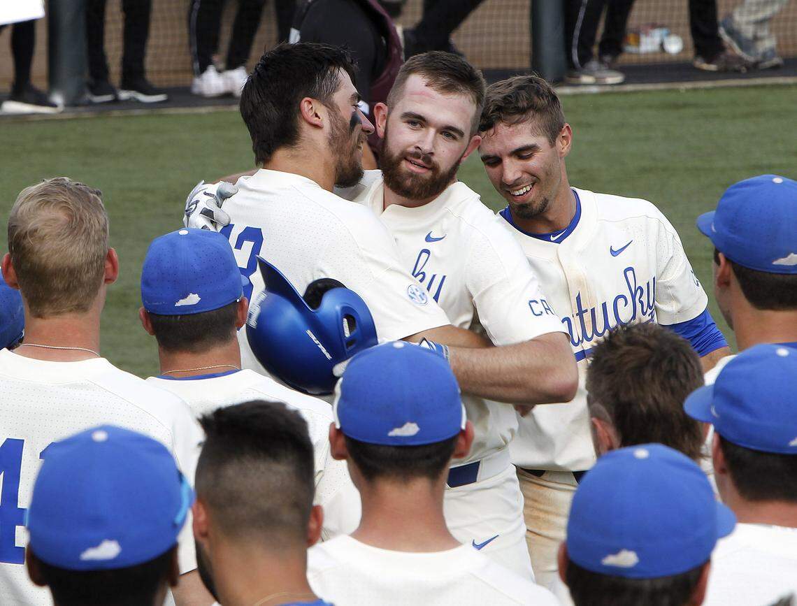 Kole Cottam hugged Brayden Combs after Combs' 3-run home run, the first hit of his UK career, during the final regular season game ever played at Cliff Hagan Stadium on Sunday.