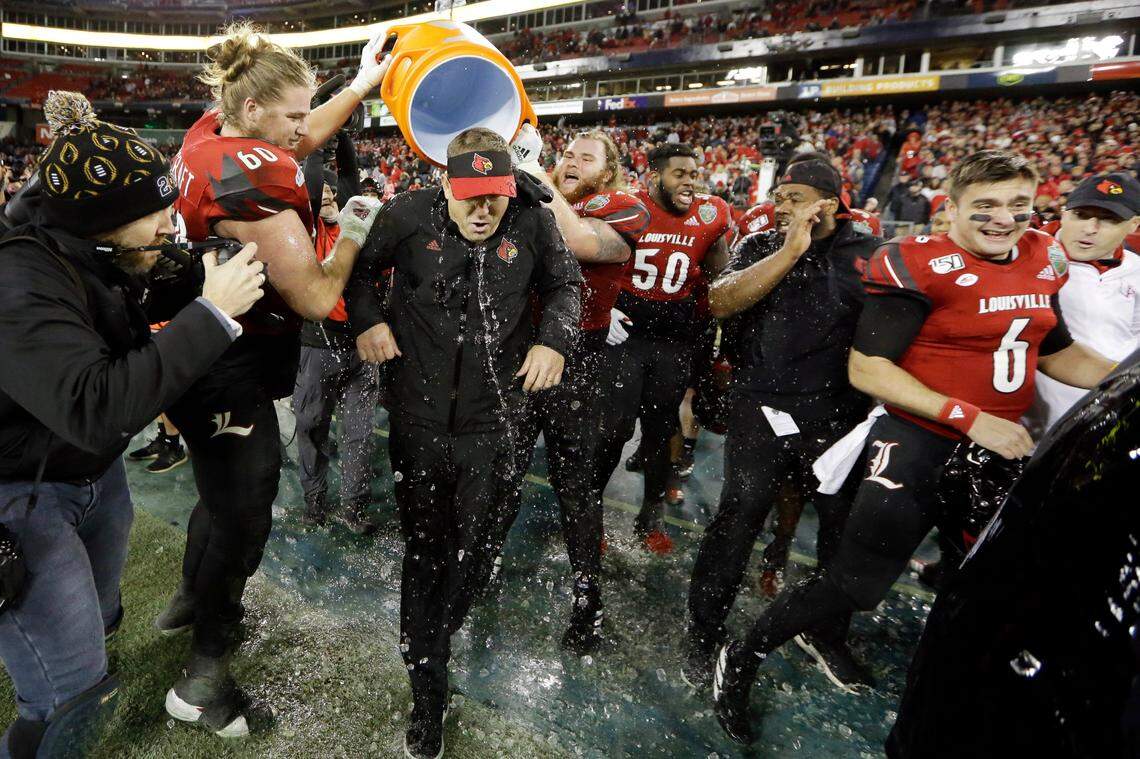 Louisville Coach Scott Satterfield got soaked with water in the final moments of Louisville’s 38-28 win over Mississippi State in the Music City Bowl.