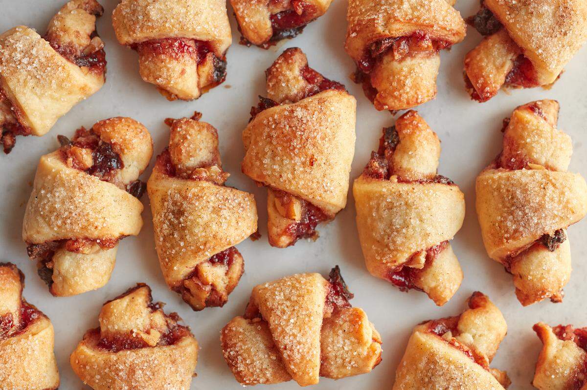 Cherry rugelach with cardamom sugar are a good fruity treat fro your holiday cookie box.