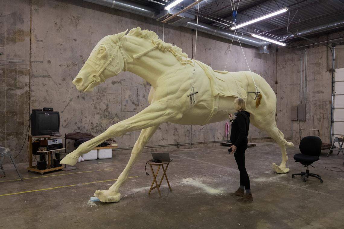 Jocelyn Russell carved details in the foam monument. Russell extensively studied horse anatomy and used a large library of historic images to shape every detail for the monument.