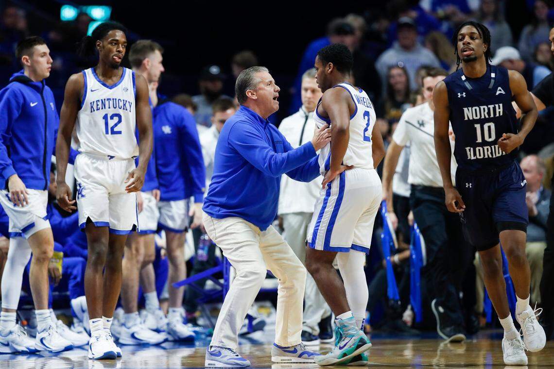 Kentucky head coach John Calipari talks with point guard Sahvir Wheeler during the game against North Florida on Wednesday.