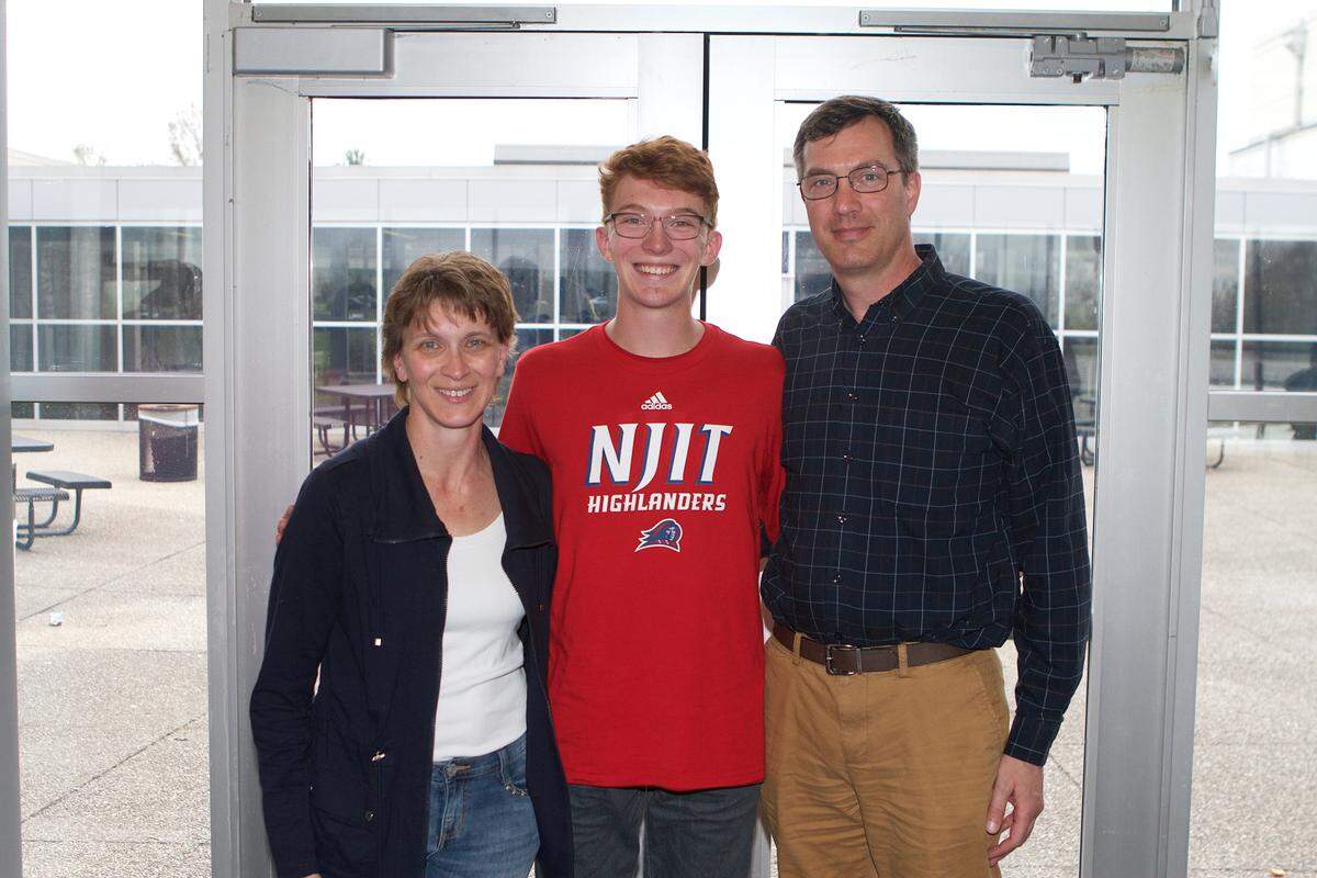 Will Andrews posed with his parents, William and Jessica Andrews, at Henry Clay's national signing day event on Monday.