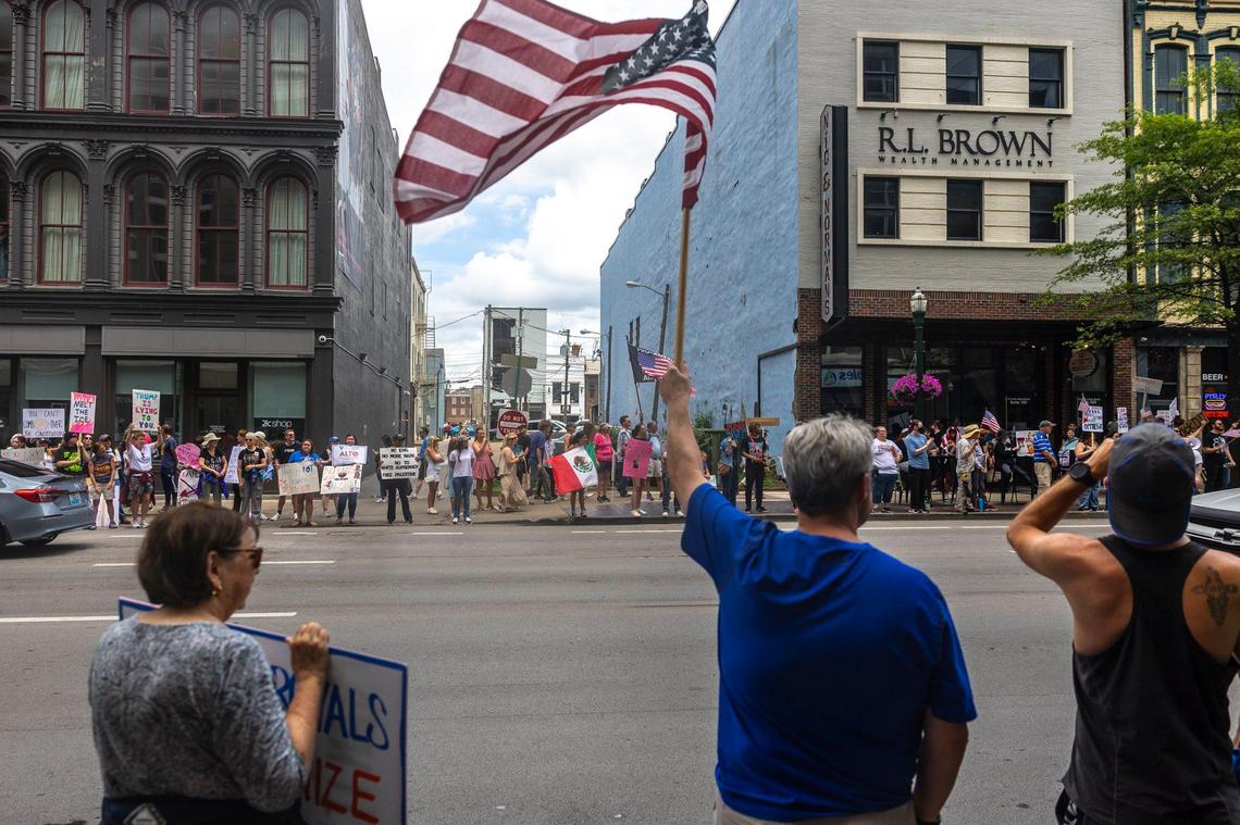 Protesters waved American flags on Main Street during the “No Kings” protest on Saturday, June 14, 2025.