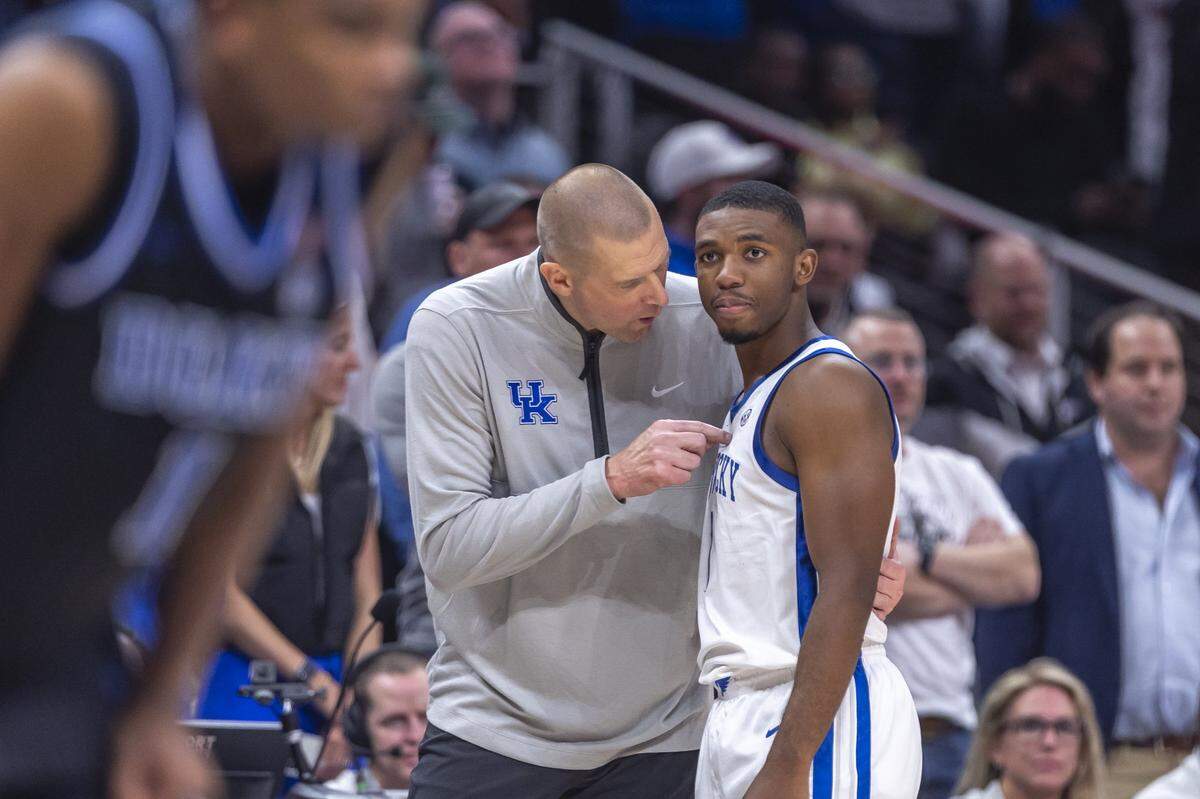 Kentucky head coach Mark Pope talks with Wildcats guard Lamont Butler during the team’s win over Duke in the Champions Classic on Tuesday night.