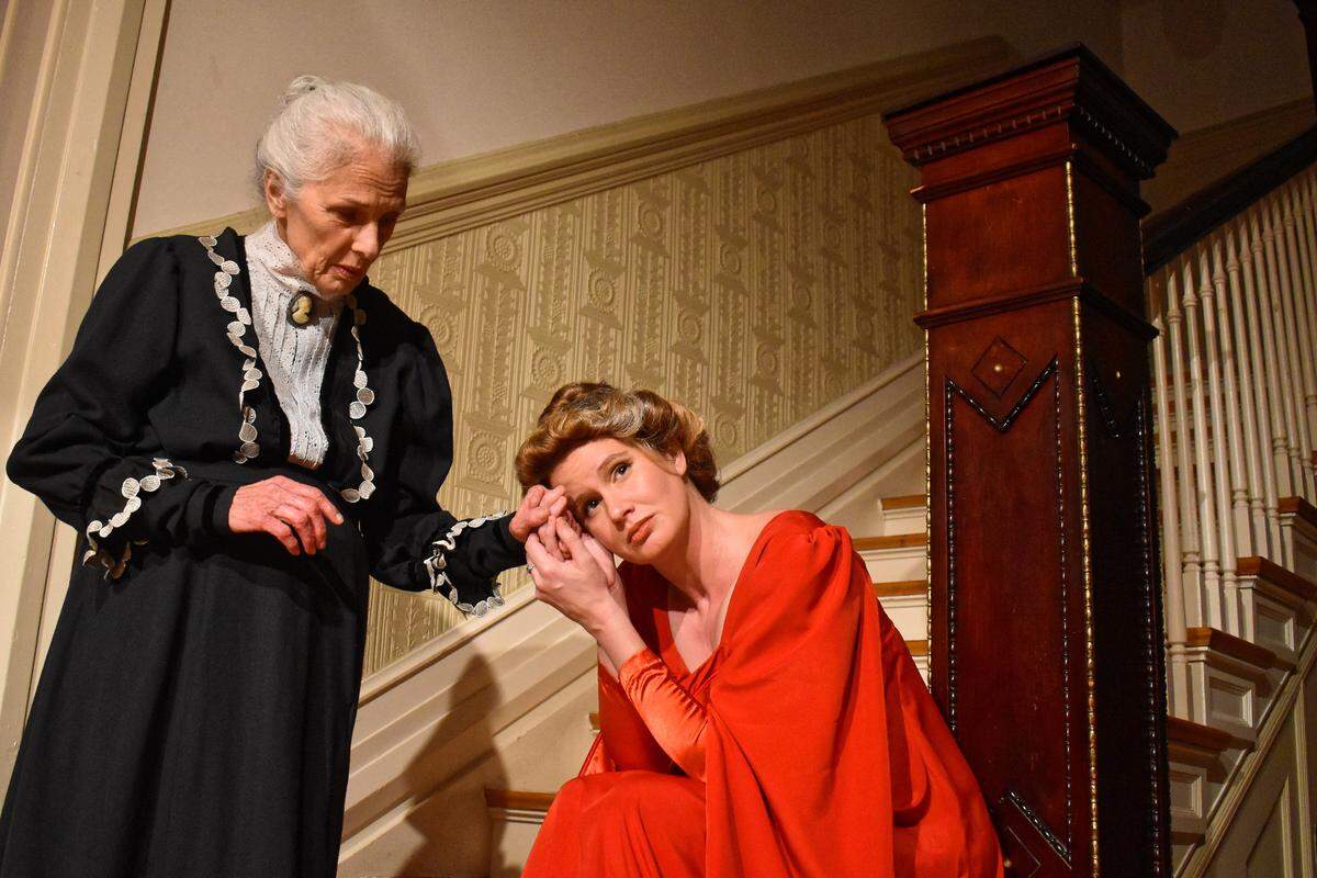 Samantha Doane-Bates (left) as Anne Marie and Rachel Lee Rogers as Nora during a rehearsal. In years past the company has performed at many nontraditional venues including the Milward Funeral Home.