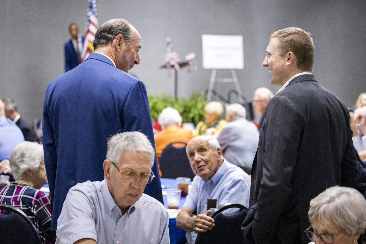 Zach Dembo, right, smiles at Rocky Adkins, left, during the annual Wendell H. Ford Dinner on Tuesday, Sept. 30, 2025, at Clay Community Center in Mount Sterling, Ky.