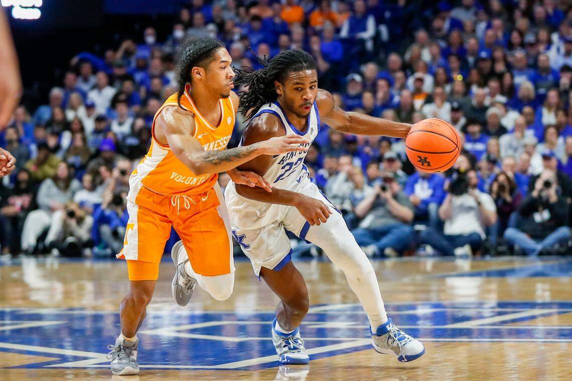 Kentucky guard Cason Wallace (22) dribbles the ball against Tennessee guard Zakai Zeigler during Saturday’s game at Rupp Arena.
