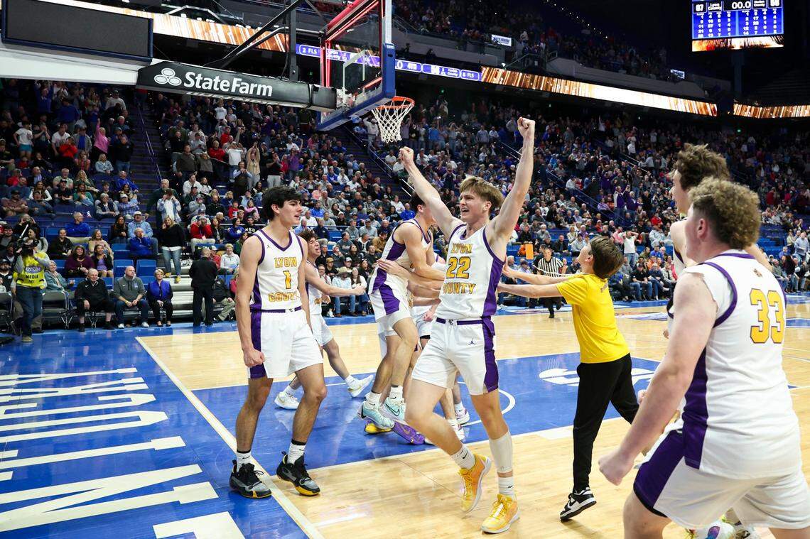 Lyon County’s Brady Shoulders (22) celebrates the Lyons defeating Harlan County 67-58 to win the Boys’ Sweet 16 championship game.