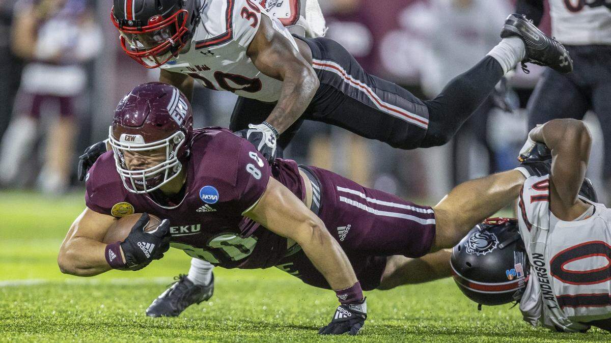 Eastern Kentucky tight end Joeseph Sewell is tackled by Gardner-Webb’s Josiah Wright during the teams’ FCS playoff game in Richmond last month. Could a move up to FBS be in the cards for the Colonels?