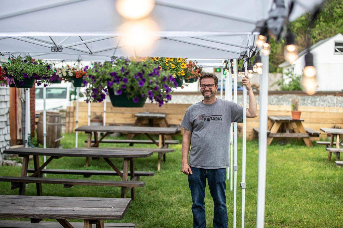 Sean Nealey, owner of PieTana, outside the restaurant Monday at 210 Rosemont Garden. Beginning Friday, in-person service will be available at the restaurant’s outdoor seating options.