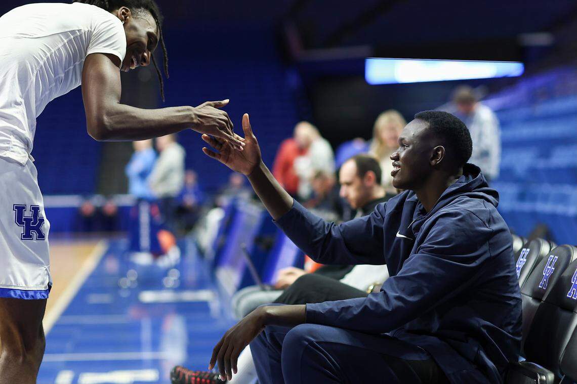 UK men’s basketball recruit Khaman Maluach (right) executes a handshake with Kentucky freshman center Aaron Bradshaw prior to a game against Ole Miss at Rupp Arena in Lexington on Tuesday, February 13, 2024.