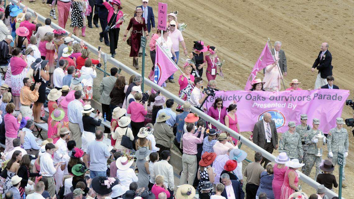 Family members accompanied 137 breast cancer survivors in the Survivors Parade on the Churchill Downs track last year on the first Friday in May, before the 137th running of the Kentucky Oaks.