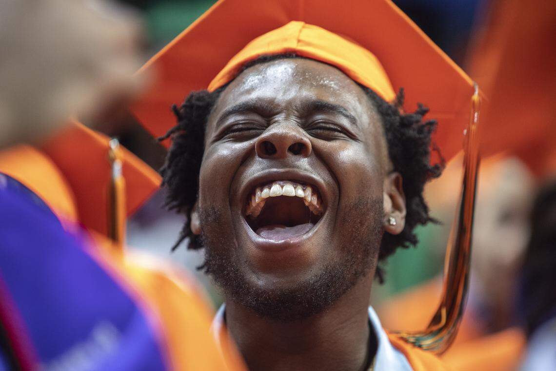 Marquis Chenault cheers at the end of the Frederick Douglass High School 2019 Commencement Ceremony at Rupp Arena on Tuesday, June 4, 2019.