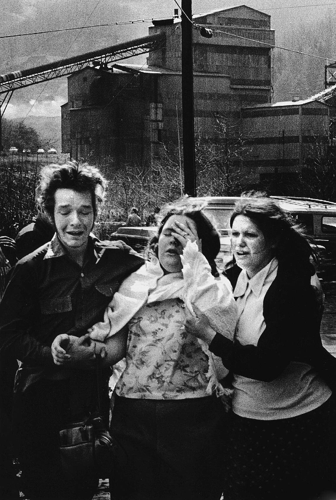 Survivors, notified in the mine office that their family member had died, shared the news with others waiting outside after the Scotia mine exploded in March 1976.