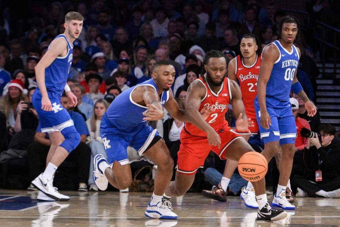 Dec 21, 2024; New York, New York, USA; Kentucky Wildcats guard Lamont Butler (1) selects the ball away from Ohio State Buckeyes guard Bruce Thornton (2) during the first half at Madison Square Garden. Mandatory Credit: John Jones-Imagn Images