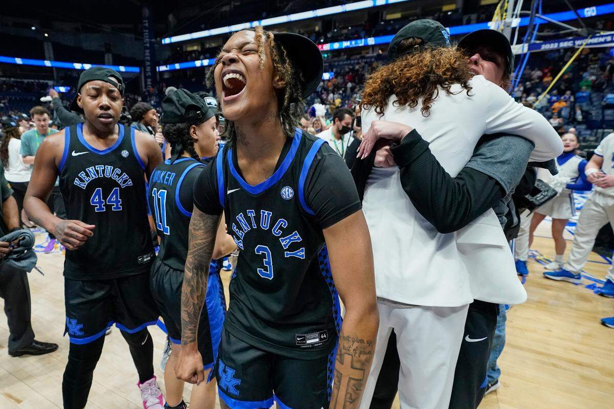 The Cats’ Jazmine Massengill (3) celebrates after her team won the SEC Tournament title in Nashville. She had seven points and six assists Sunday against South Carolina.