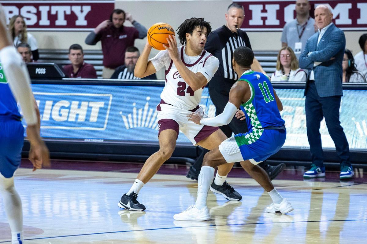 Eastern Kentucky forward Michael Moreno (24) looks to move the ball as Florida Gulf Coast guard Isaiah Thompson (11) defends during a game at Baptist Health Arena in Richmond on Feb. 7.
