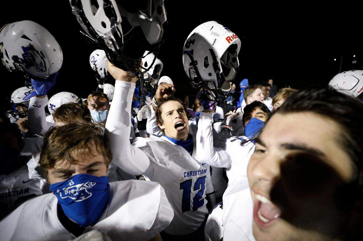 Lexington Christian’s Drew Nieves (12) celebrates with teammates after their game at Somerset on Oct. 16, 2020. LCA won 28-21.
