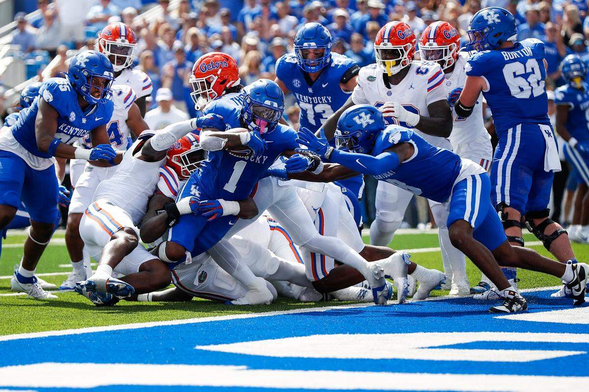 Kentucky Wildcats running back Ray Davis (1) dives into the end zone for a score against Florida during Saturday’s game at Kroger Field.