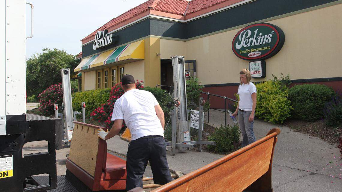 Fast Track Auction employees moved booths, tables and other items out of the Perkins' Family Restaurant on Sunday, April 29, 2012 in Lexington, Ky. Photo by Laura Strange | STAFF