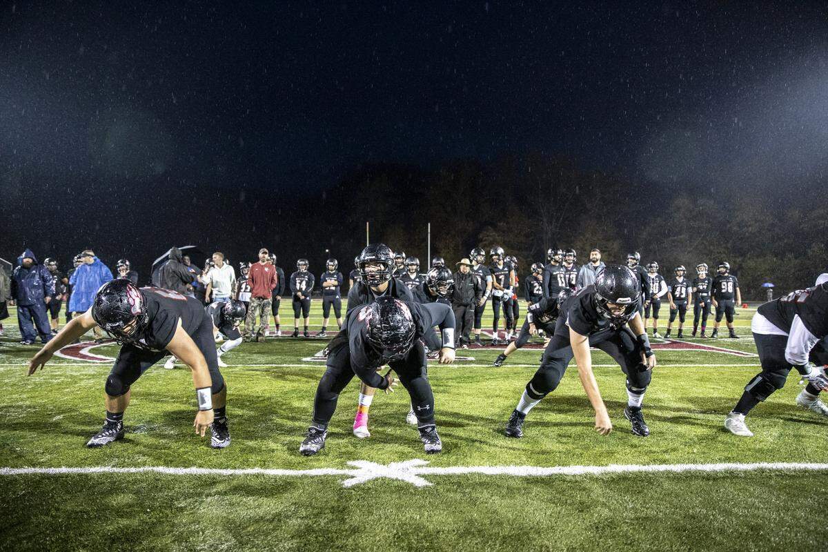 The Black Bears run plays before the start of their game.