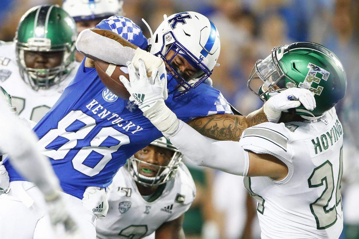 Kentucky tight end Keaton Upshaw (88) fought for extra yards against Eastern Michigan defensive back Brody Hoying (24) during UK's 38-17 victory over the Eagles. 
