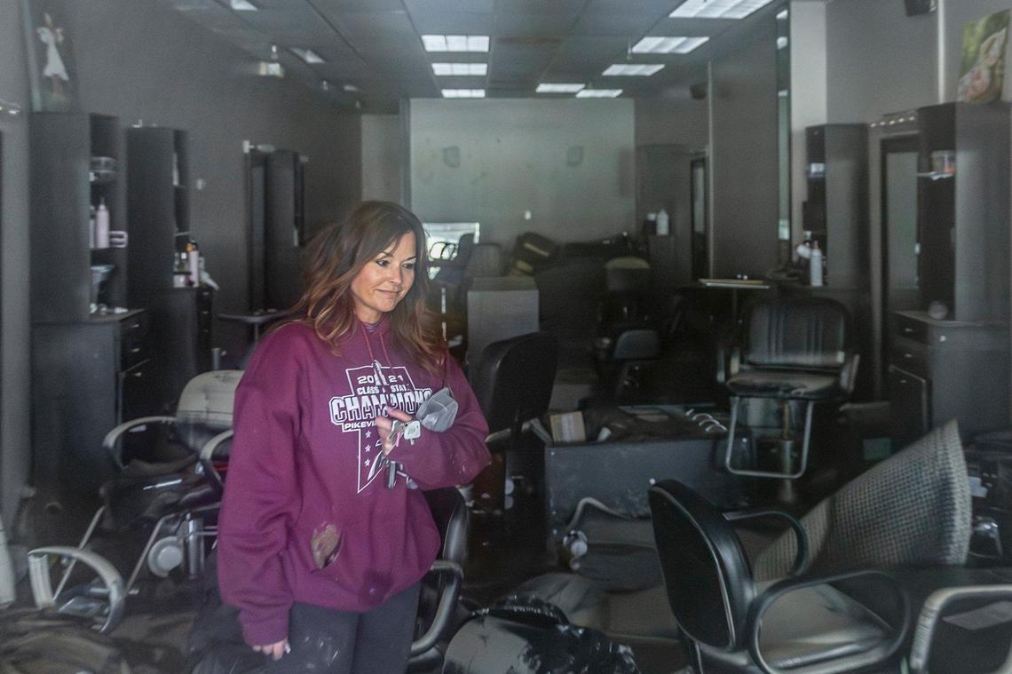 Trish Moore, owner of Head’z to Toe’z looks at the damage caused by flooding to her business in Coal Run Village in Pike County, Ky., on Monday, Feb. 17, 2025. Heavy rainfall lead to flooding throughout Kentucky over the weekend.