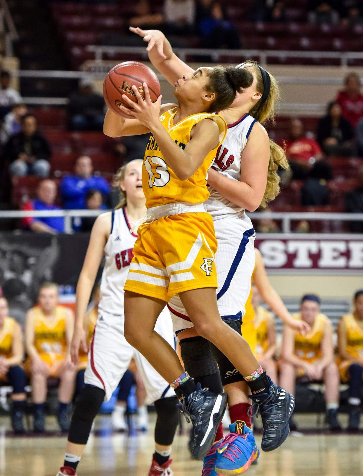 Franklin County’s Brooklynn Miles (13) scored over Lafayette’s Kiara Pankins (22) during the girls’ 11th Region Tournament finals on March 4, 2017. Miles started as an eighth-grader on that year’s state finals team.