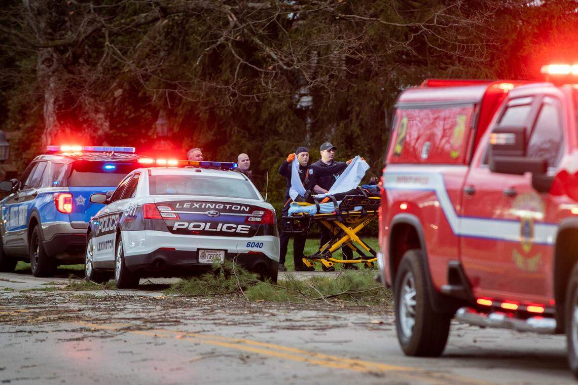 Firefighters and EMS respond to a person injured from fallen trees from the storm in Lexington, Ky., Friday, March 3, 2022.