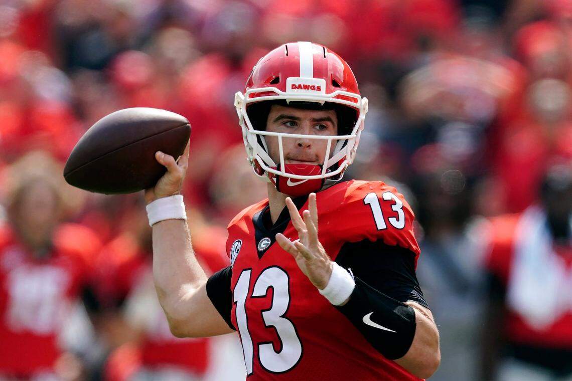 With USC transfer J.T. Daniels battling a lat injury, former walk-on Stetson Bennett (13) has been pressed into starting duty for No. 2 Georgia.