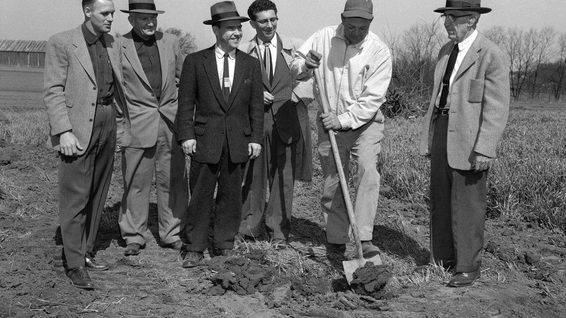 ORIGINAL CAPTION FOR 1955 HERALD-LEADER PHOTO: Minority Housing Project Begun. Joseph N. Fister, Jr., breaks ground to mark the beginning of St. Martin’s Village, a subdivision to be located on his property fronting on Price Road. Watching, left to right, are J.J. Tuttle, supervisor of building and partner in the corporation; Tom Robinson, consultant for the Department of Public Works; C.M. Seeberger, president of the corporation; Don Saylor, City-County Planning and Zoning Commissioner and G.W. Gard, city engineer. The subdivision will be a minority group project. Photo published April 10, 1955. Herald-Leader