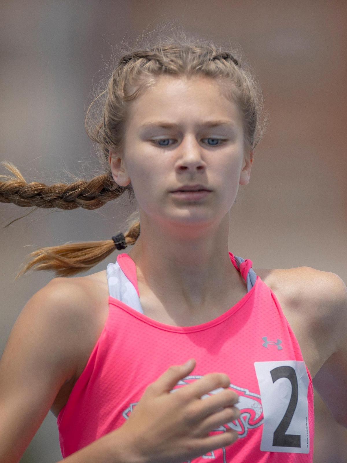Annie Sewell of Lexington Christian competes in the 800-meter run at UK on Thursday. The eighth-grader finished third to score six points for her team.