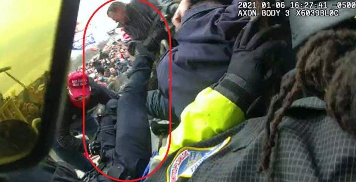 Clayton Mullins, a Kentucky resident, was arrested for allegedly participating in the Capitol riot on Jan. 6, 2021. This capture from body camera footage allegedly shows Mullins pulling a police officer to the ground.