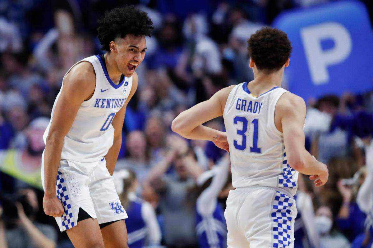Kentucky’s Jacob Toppin (0) celebrates with Kellan Grady (31) after he hit a shot to help the Cats take the lead from Alabama during Saturday’s game at Rupp Arena.