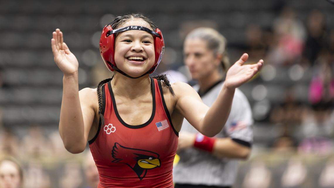 Taylor County’s Naiya Delo Santos celebrated her win in the 100-pound finals in the 2026 KHSAA Girls State Wrestling Championships at the Kentucky Horse Park’s Alltech Arena on Saturday. She was named the meet’s most outstanding wrestler.
