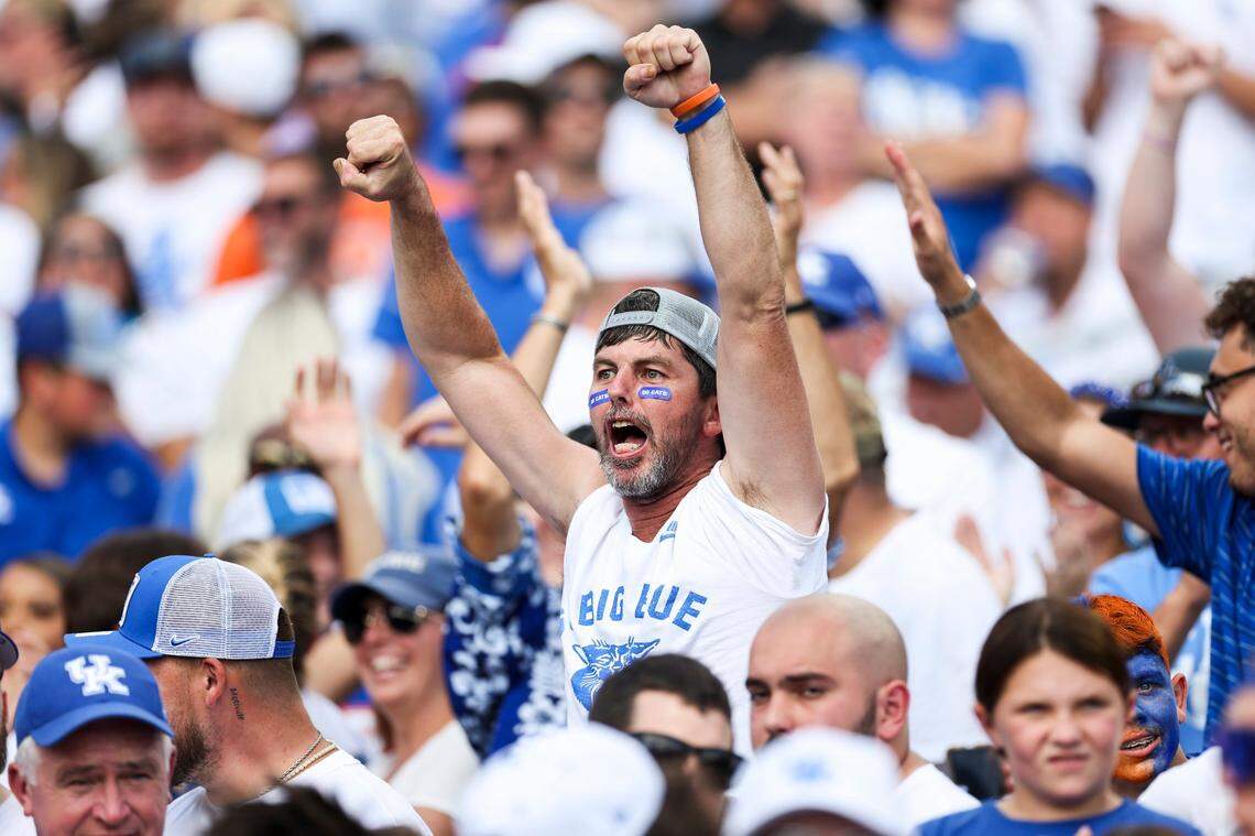 Kentucky fans cheer after the Wildcats scored against Florida during a game at Kroger Field on Sept. 30, 2023.