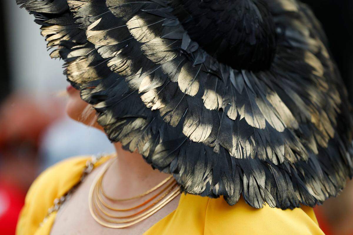 Lili Somoano, from Miami, wore a black and gold feathered hat frin Suzy Buckley Woodward Hat Design for the Kentucky Derby at at Churchill Downs in Louisville, Ky., Saturday, May 6, 2023.