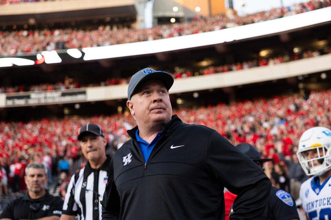 Mark Stoops has led Kentucky to wins in six of its last 11 games against ranked teams, but the Wildcats have lost 14 in a row against Georgia.