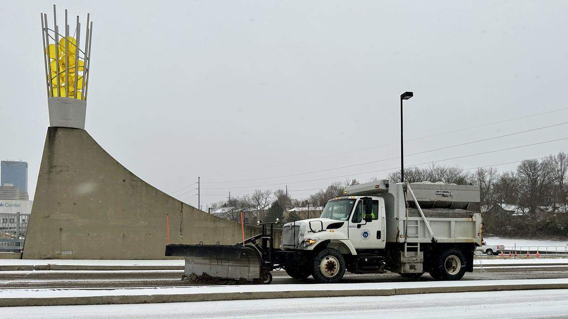 A city snow plow clears Oliver Lewis Way during rush-hour downtown traffic after freezing rain and snow fell Jan. 21, 2026 in Lexington.