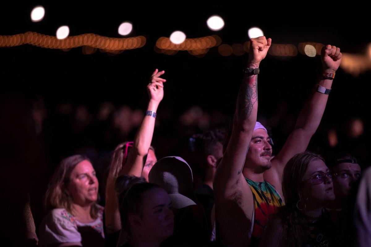 Festival goers cheer as My Morning Jacket’s performs at the Railbird Festival at Keeneland in Lexington, Ky., on Saturday, Aug. 28, 2021.