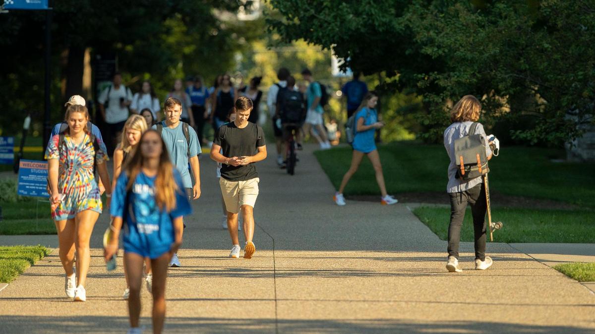 Students walk along the University of Kentucky campus in Lexington, Ky., on the first day of classes for the fall semester Monday, Aug. 23, 2021.