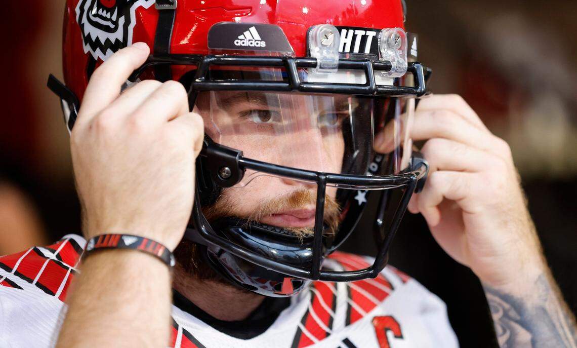 N.C. State quarterback Devin Leary (13) gets ready to head out onto the field to warmup before N.C. State’s game against Clemson at Memorial Stadium in Clemson, S.C., Saturday, Oct. 1, 2022.