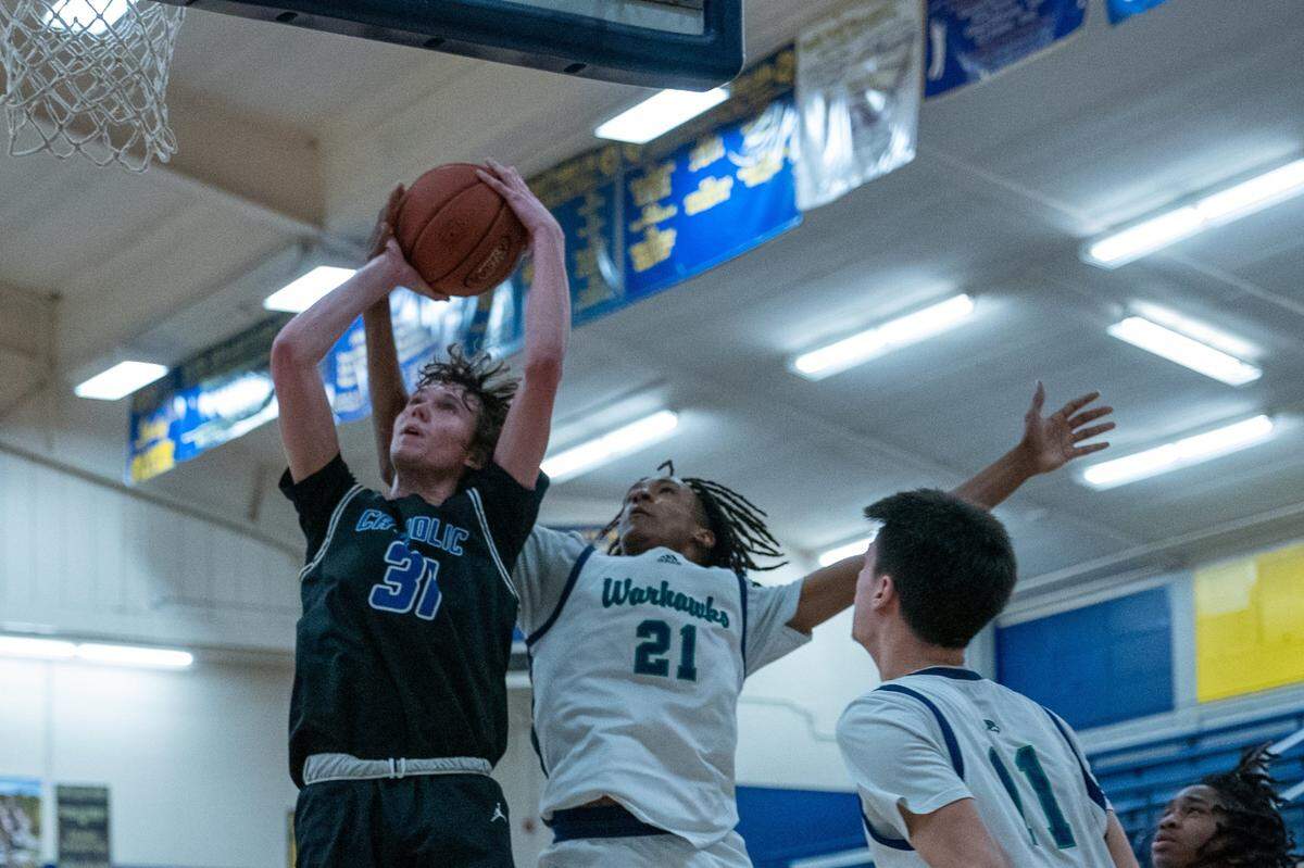 Lexington Catholic’s Hudson Sparks (31) puts up a shot during the top-ranked Knights’ win over Great Crossing at Franklin County High School last month. LexCath and Great Crossing enter the postseason as two of the highest-rated teams in the 11th Region.