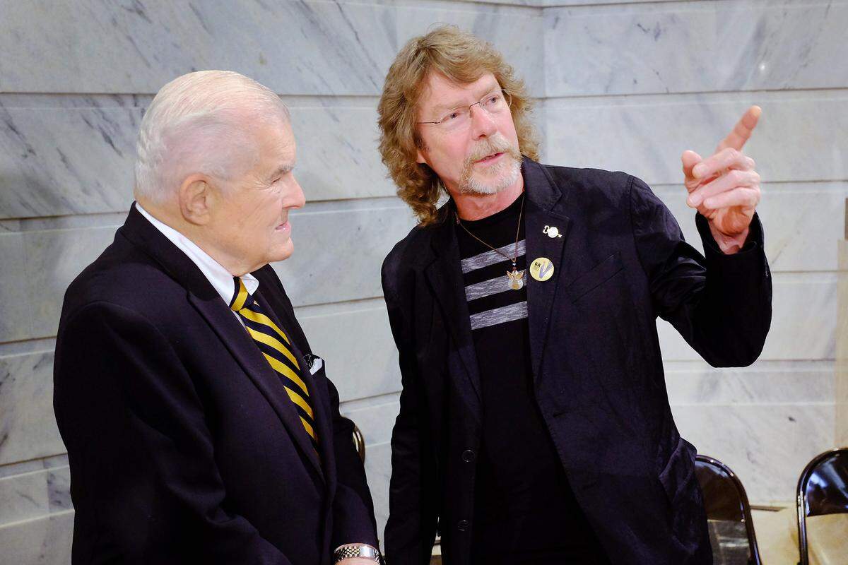 Bluegrass music star Sam Bush, right, chatted with newspaperman Al Smith after the Governor’s Awards in the Arts ceremony in the Capitol rotunda in Frankfort on Oct. 22, 2015. Bush won the national artist award, while Smith won the Milner Award for his longtime service and advocacy of the arts in Kentucky.