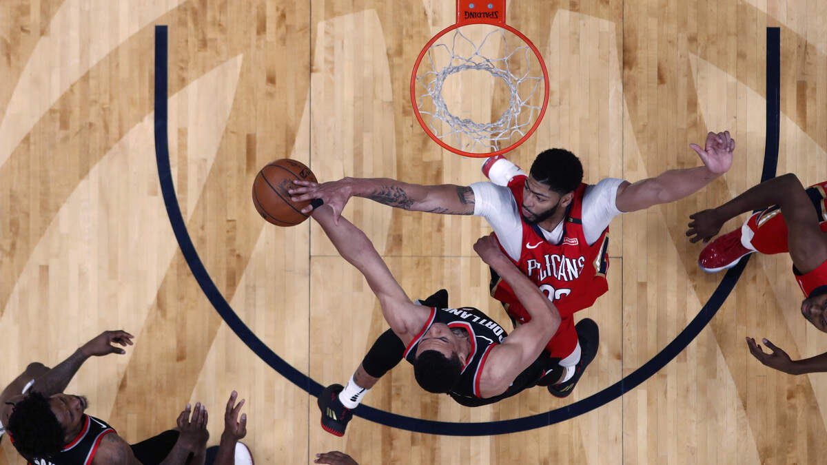New Orleans Pelicans forward Anthony Davis blocks a shot by Portland Trail Blazers guard Wade Baldwin IV during Game 4 of their first-round NBA basketball playoff series in New Orleans on Saturday.