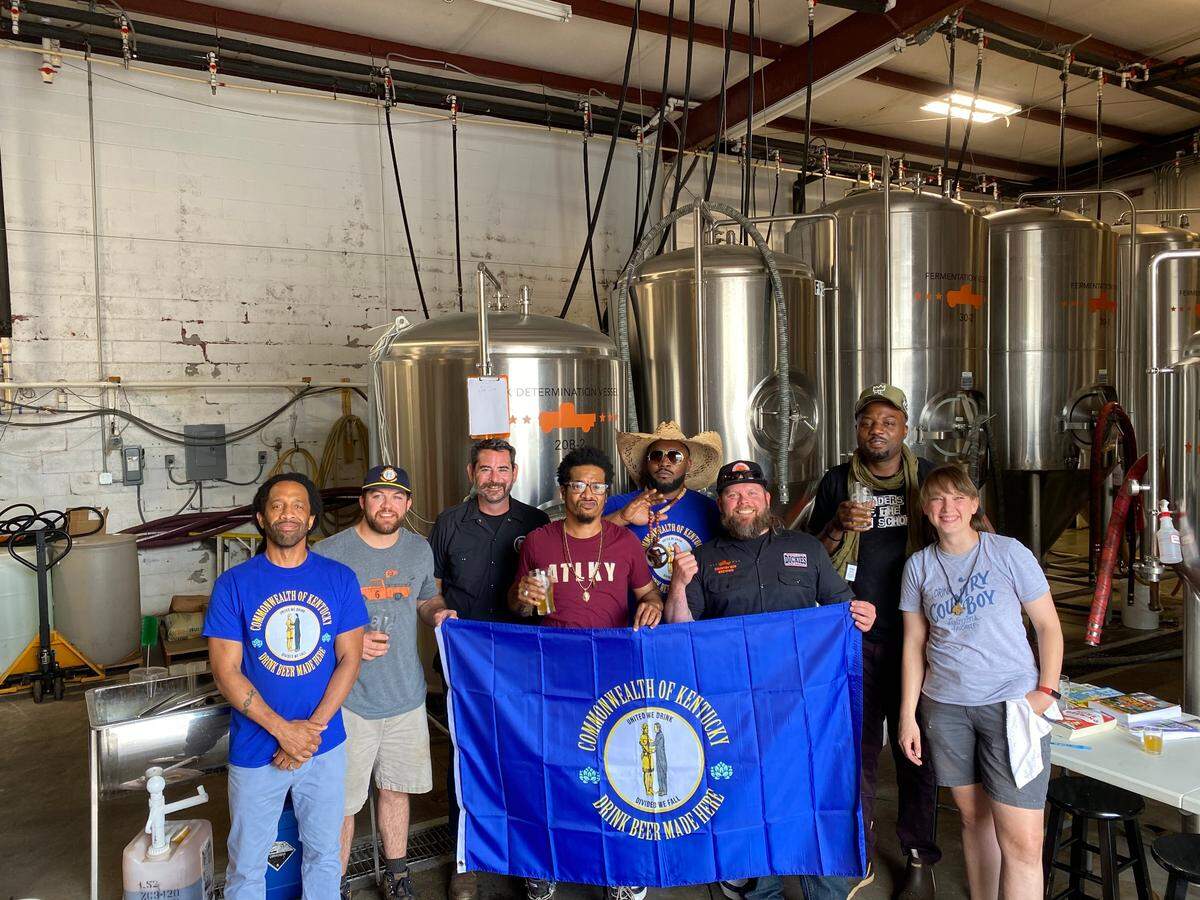 All proceeds from Backroads Blackberry Berliner will be donated to the Kentucky Institute for Music Industry Development. From left, Ron Clutch, Keenan Freitag, Derek Selznick, Skinny DeVille, B. Stille, Daniel “DH” Harrison, Fish Scales and Stephanie Miracle.