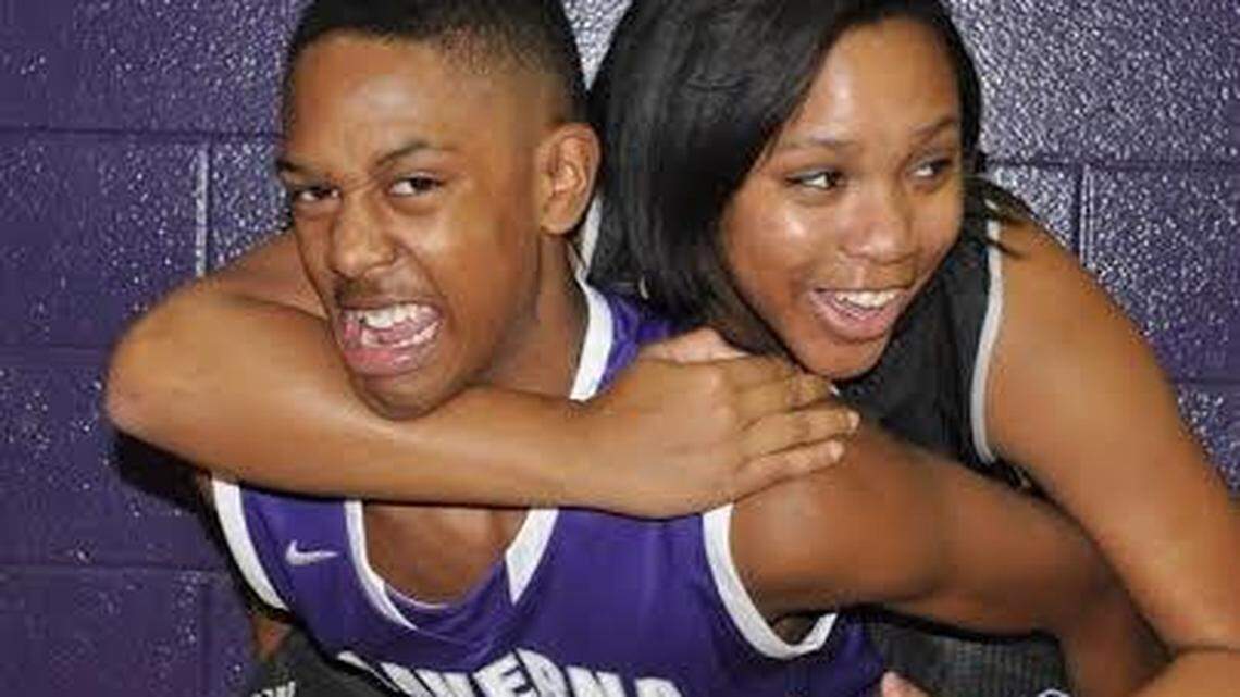 Twins Mason, left, and Madison Faulkner are basketball stars at Caverna. Their teams often play doubleheaders, enabling their father, the girls' coach, to see both play.  