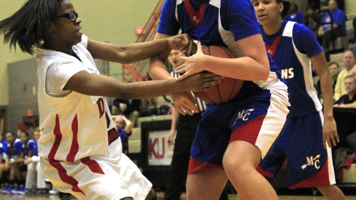 Madison Central's Heather Hinkle, right, stole the ball from Dunbar's Jordin Fender  in the fourth quarter. Down 10 in the first half, Central rallied to take the lead for good with 1:34 left in the game.    
