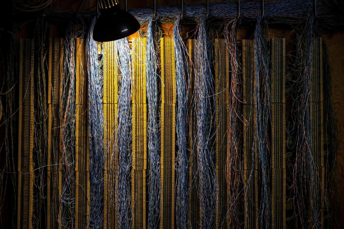 Telephone lines are connected through a room in the basement of the Kentucky state Capitol in Frankfort, Ky., on Tuesday, Oct. 6, 2021. As part of renovations and repairs being undertaken at the Capitol, obsolete and unused wires and cables will be removed.